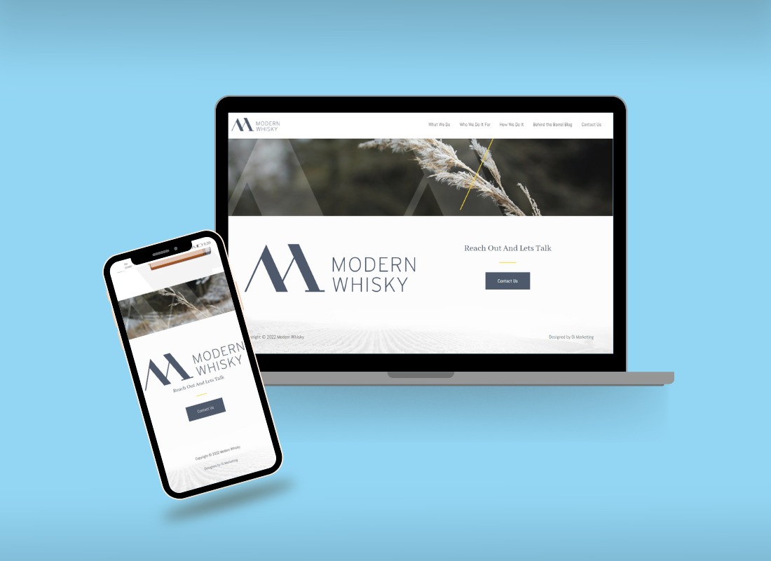 A laptop and smartphone mockup of the Modern Whisky website, designed by Oi Marketing, showing its navigation menu, header photo and a "Reach Out And Lets Talk" contact section.